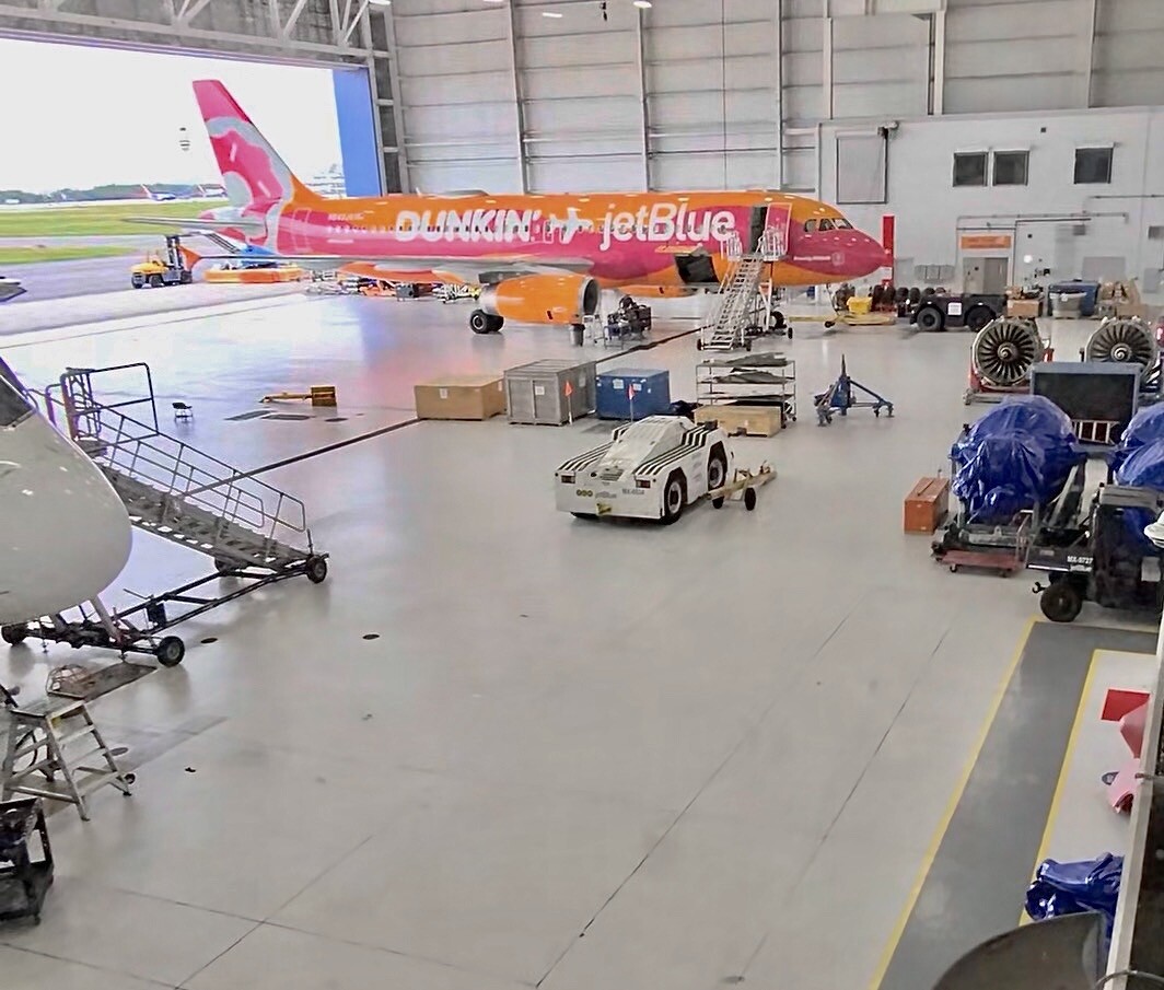 JetBlue aircraft inside a maintenance hangar at Orlando International Airport