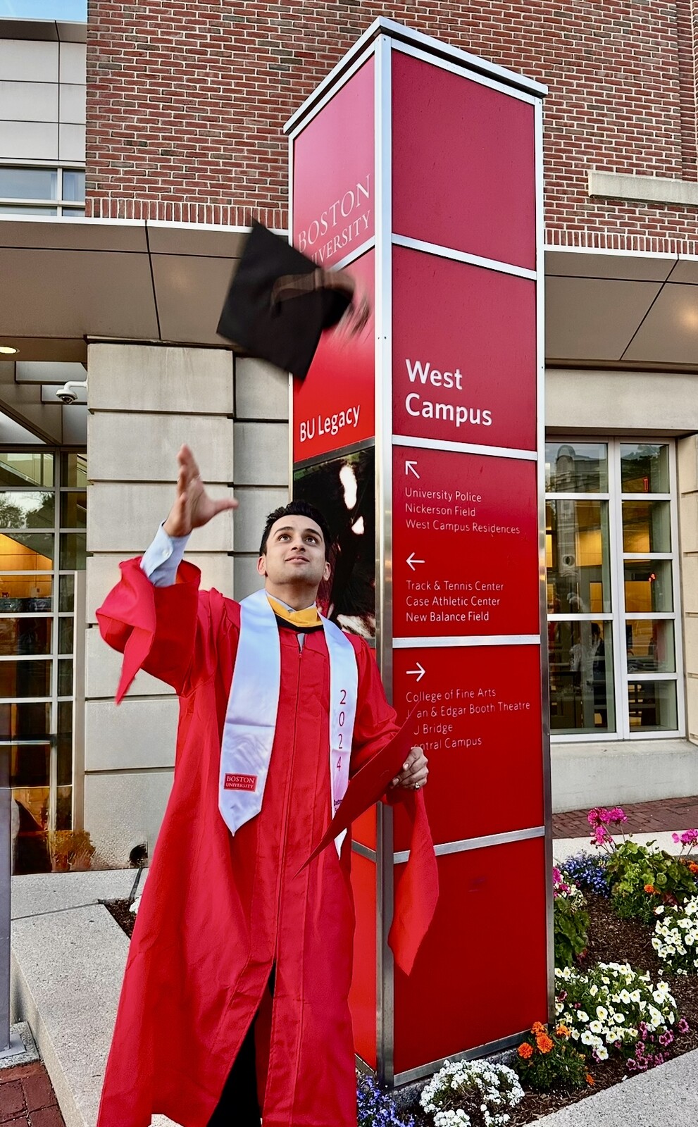 Shubham Mishra celebrating graduation in Boston University regalia